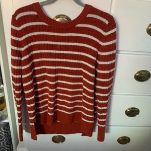 stripped, burnt orange sweater.
